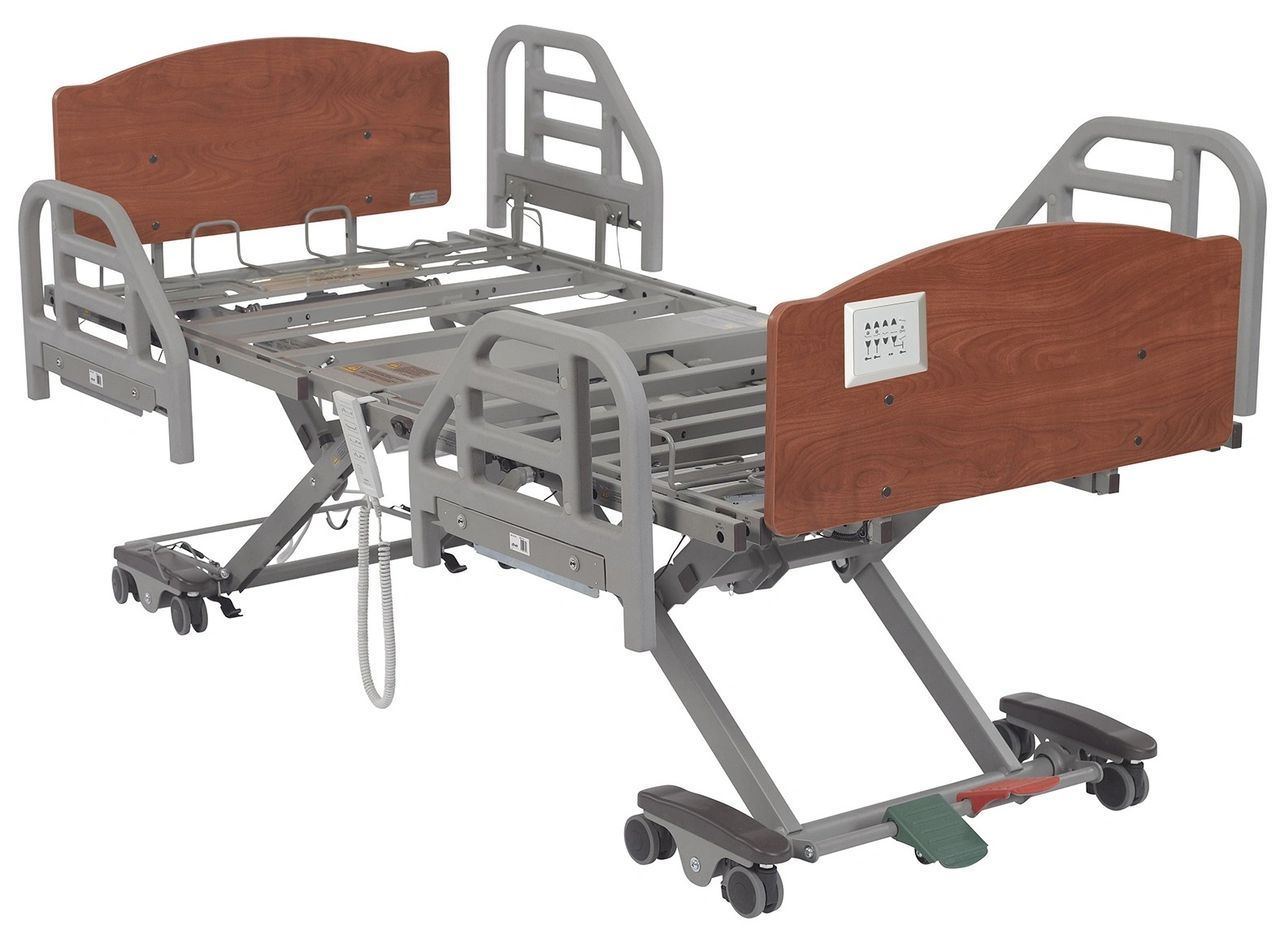Hospital bed with brown head and foot panels and gray metal rails on caster wheels