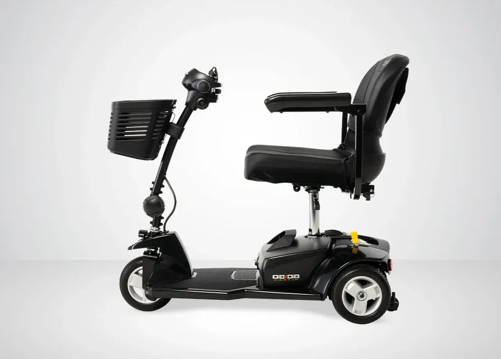 Black mobility scooter with basket and seat on a white background