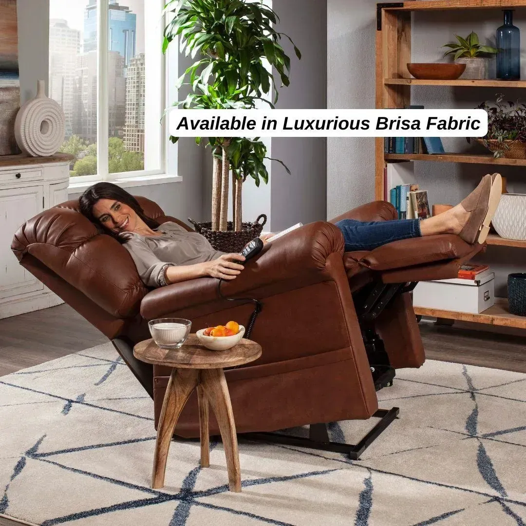 Person reclining in a brown leather chair in a bright living room, with a small table and rug nearby.