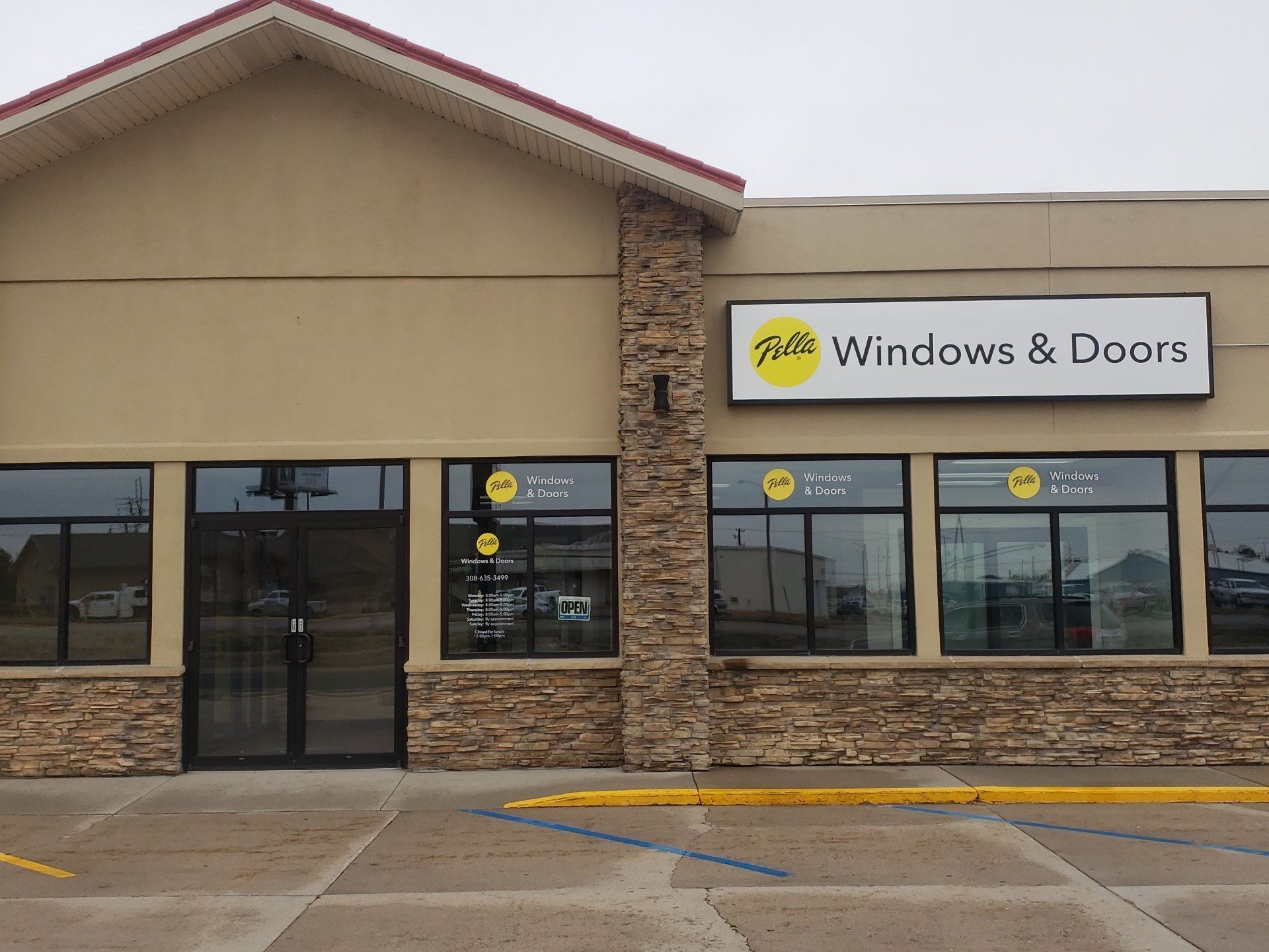 A building with a sign that says windows and doors