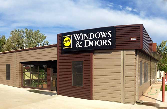 A building with a sign that says windows and doors