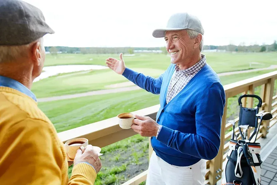 Golfers enjoying coffee at the course