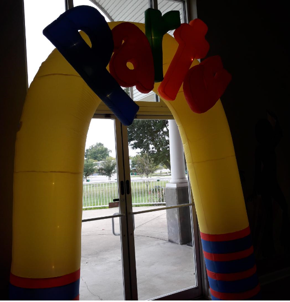 A yellow inflatable archway with the word park on it