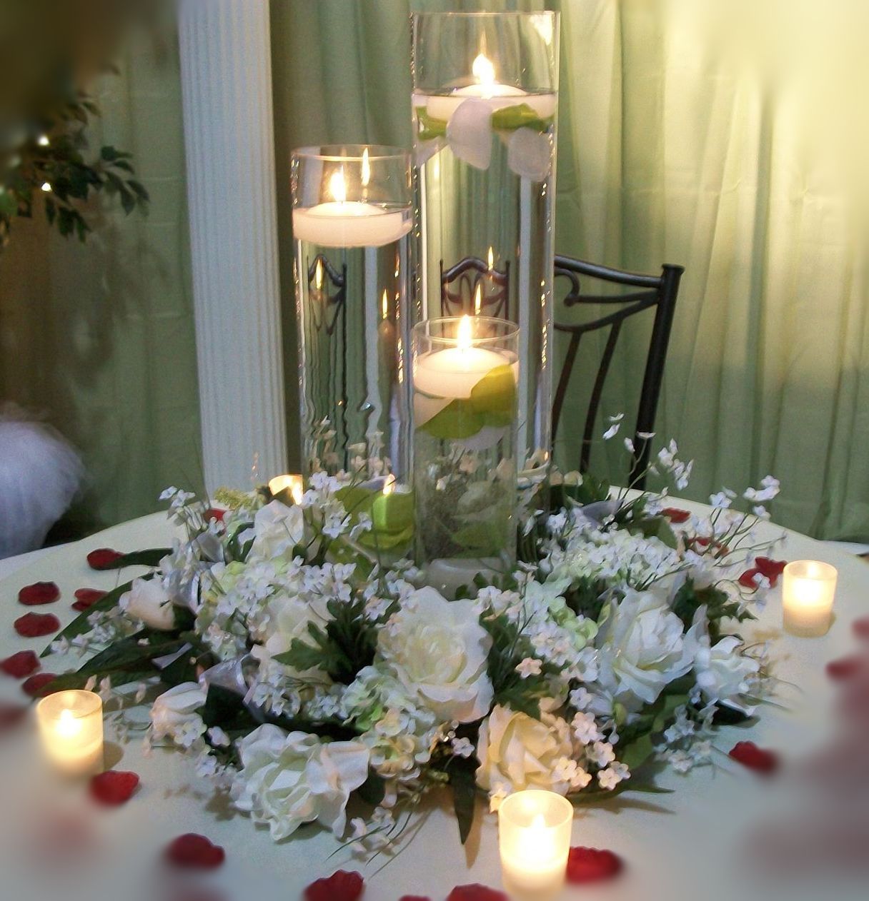 A table with flowers and candles on it