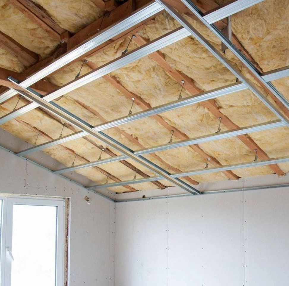 Interior construction: Insulation and metal framing installed on a sloped ceiling.