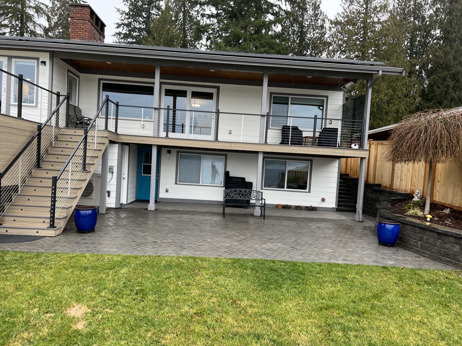 A large white house with a large lawn in Monroe, WA.