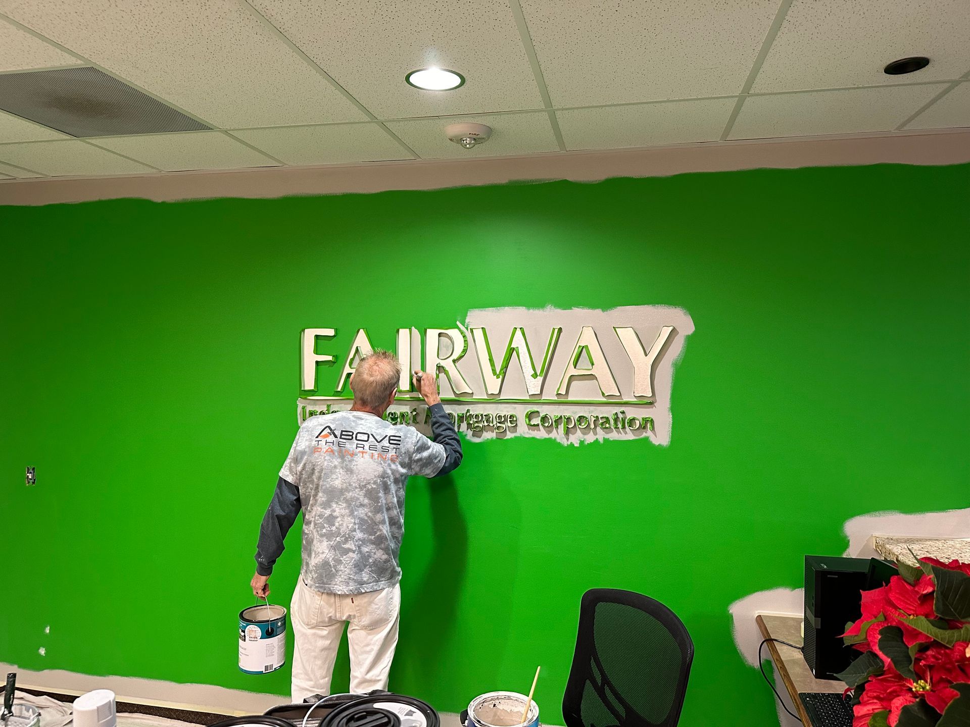 Man painting over 