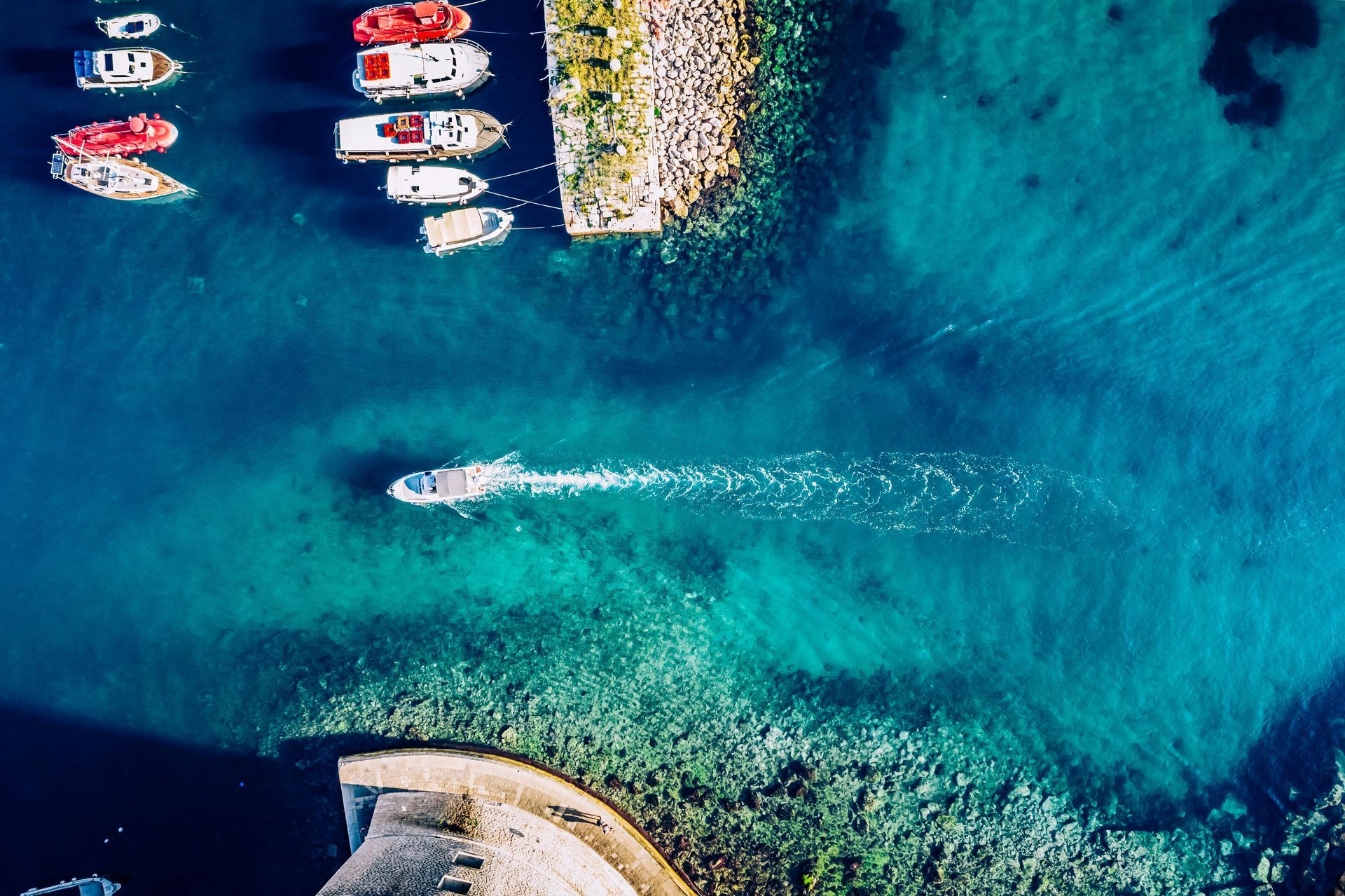 Greece- a view of the ocean with boats sailing