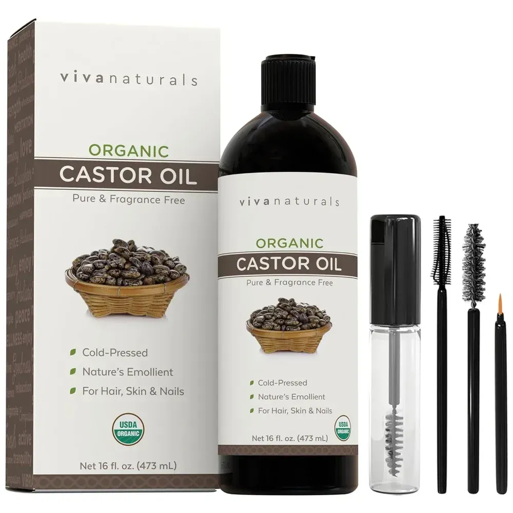 Vivnaturals organic castor oil bottle with box and mascara tube, brush, and applicators on white background