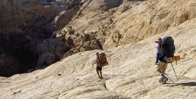 people hiking down a mountain