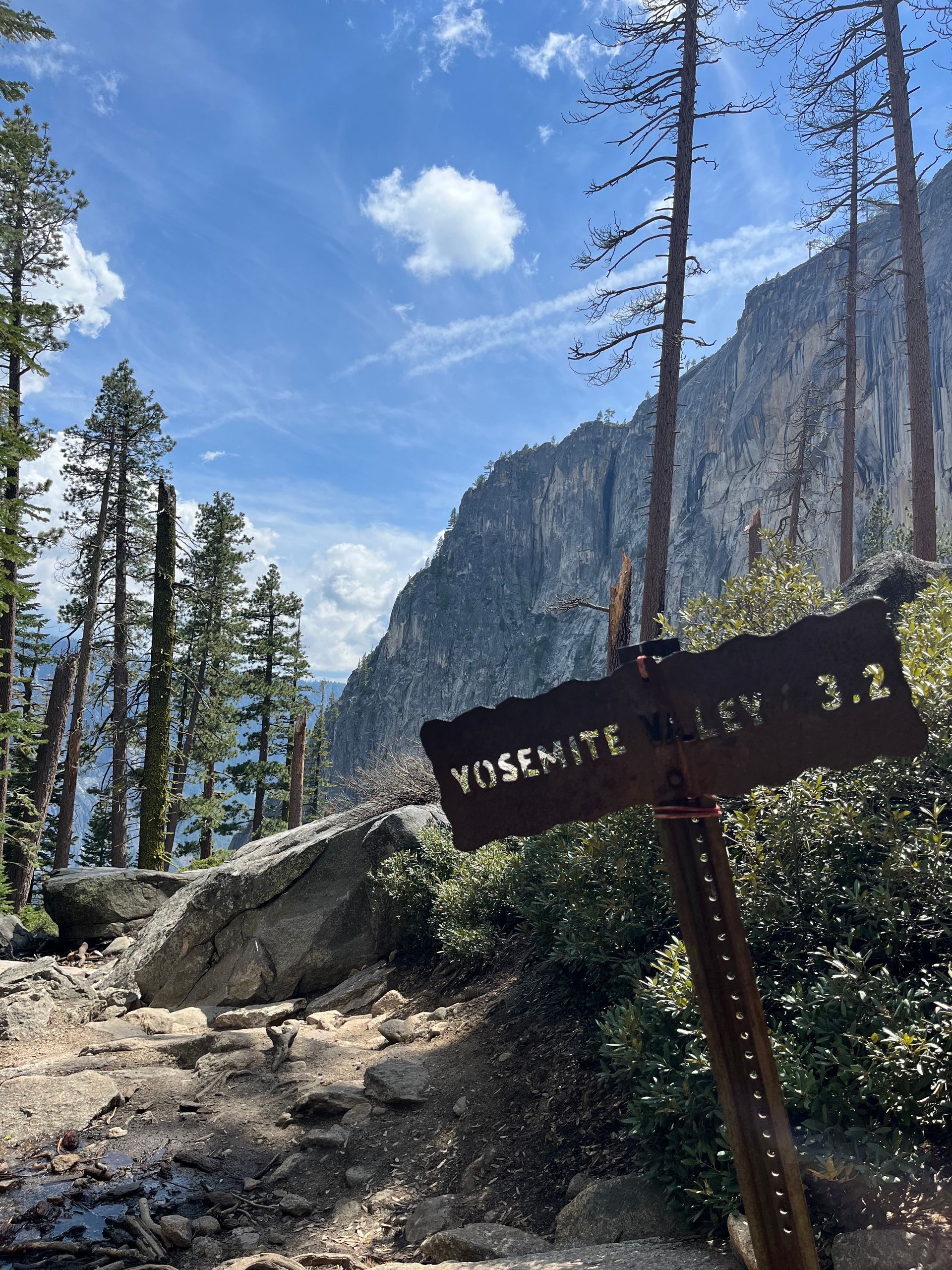 A sign that says yosemite valley 3.2 on it