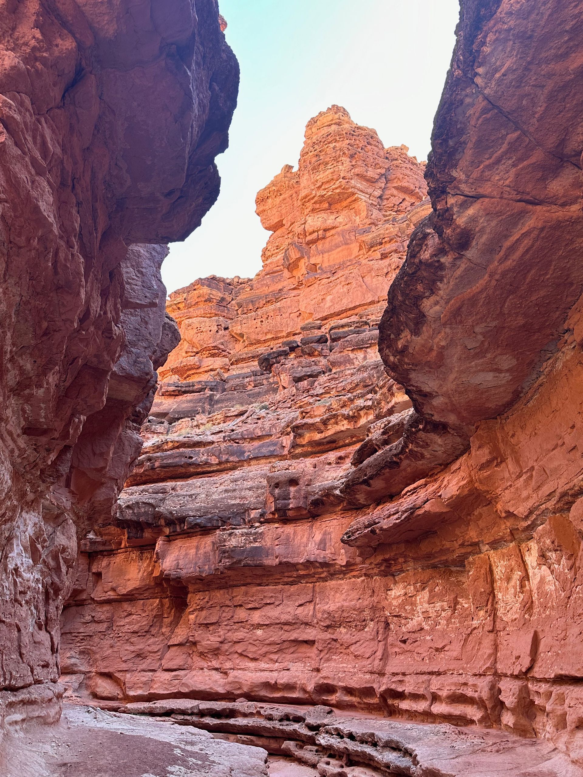 A canyon filled with rocks and a mountain in the background.