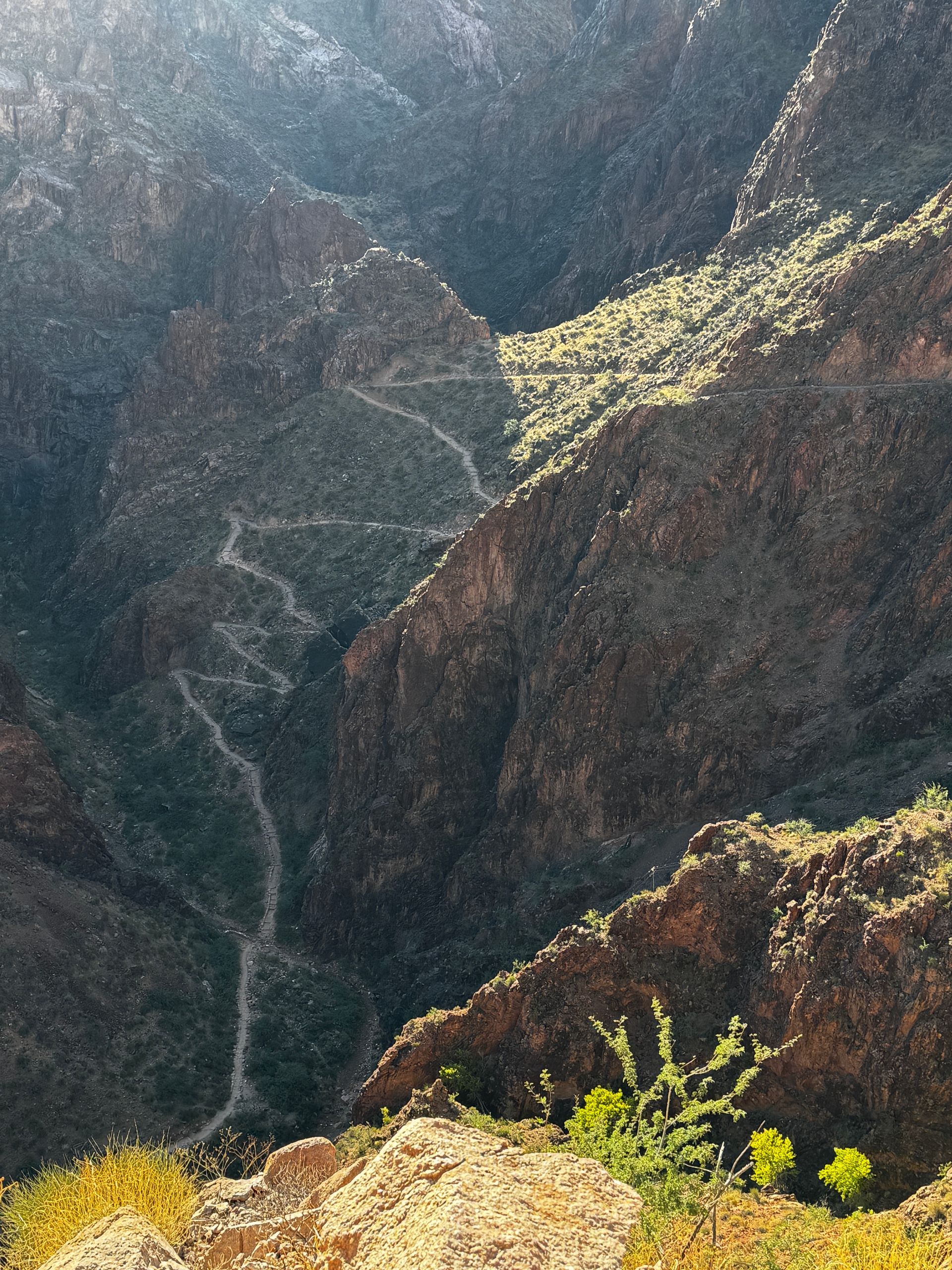 A view of a canyon with a road going through it