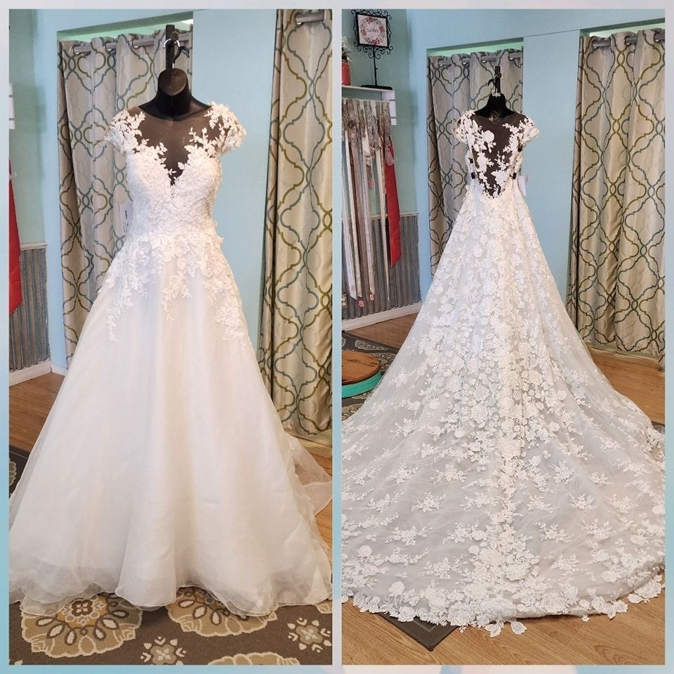 Two views of a white lace wedding dress with long train on a mannequin in a room