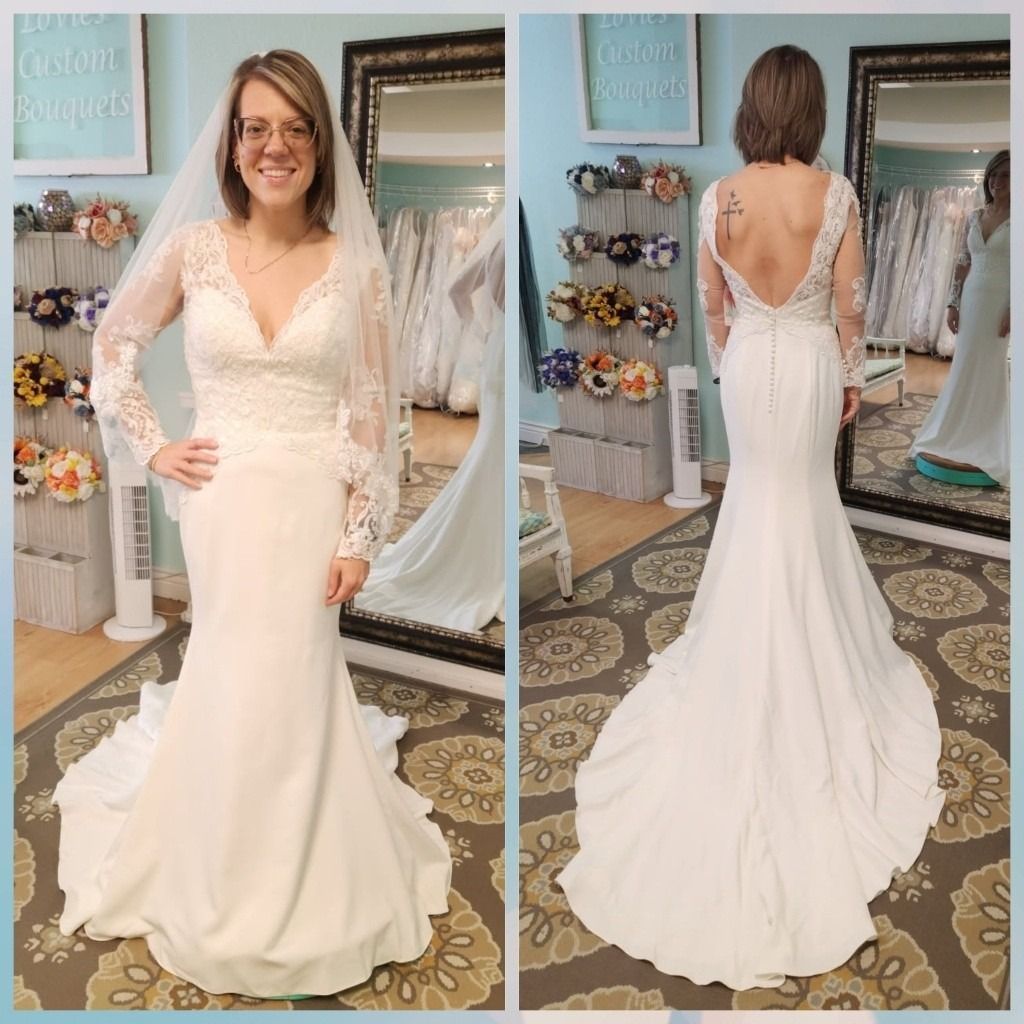 Woman modeling a white lace wedding dress, front and back view in a bridal boutique.