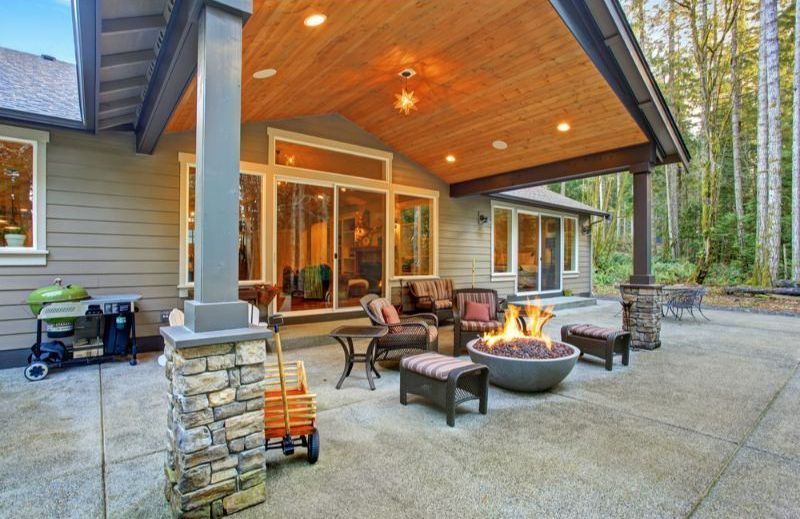 There is a Fire Pit on the Patio of a House — Turnscape Landscaping in Hope Island, QLD