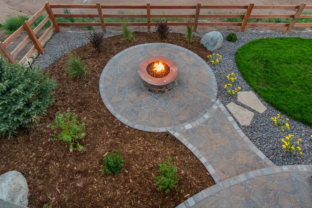 An aerial view of a fire pit in the middle of a garden. — Turnscape Landscaping in Beechmont, QLD