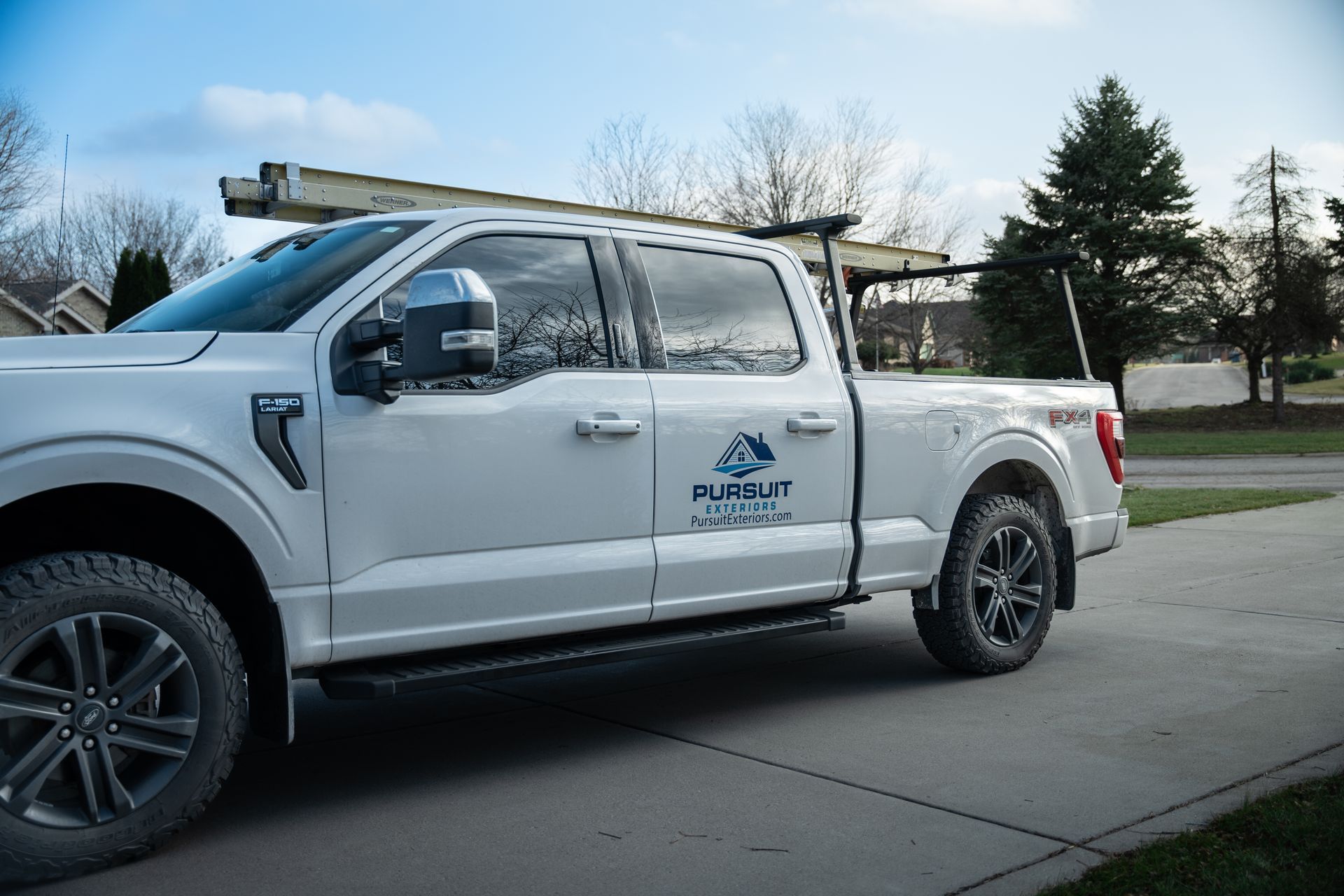 Pursuit Exteriors Truck at Siding Installation job
