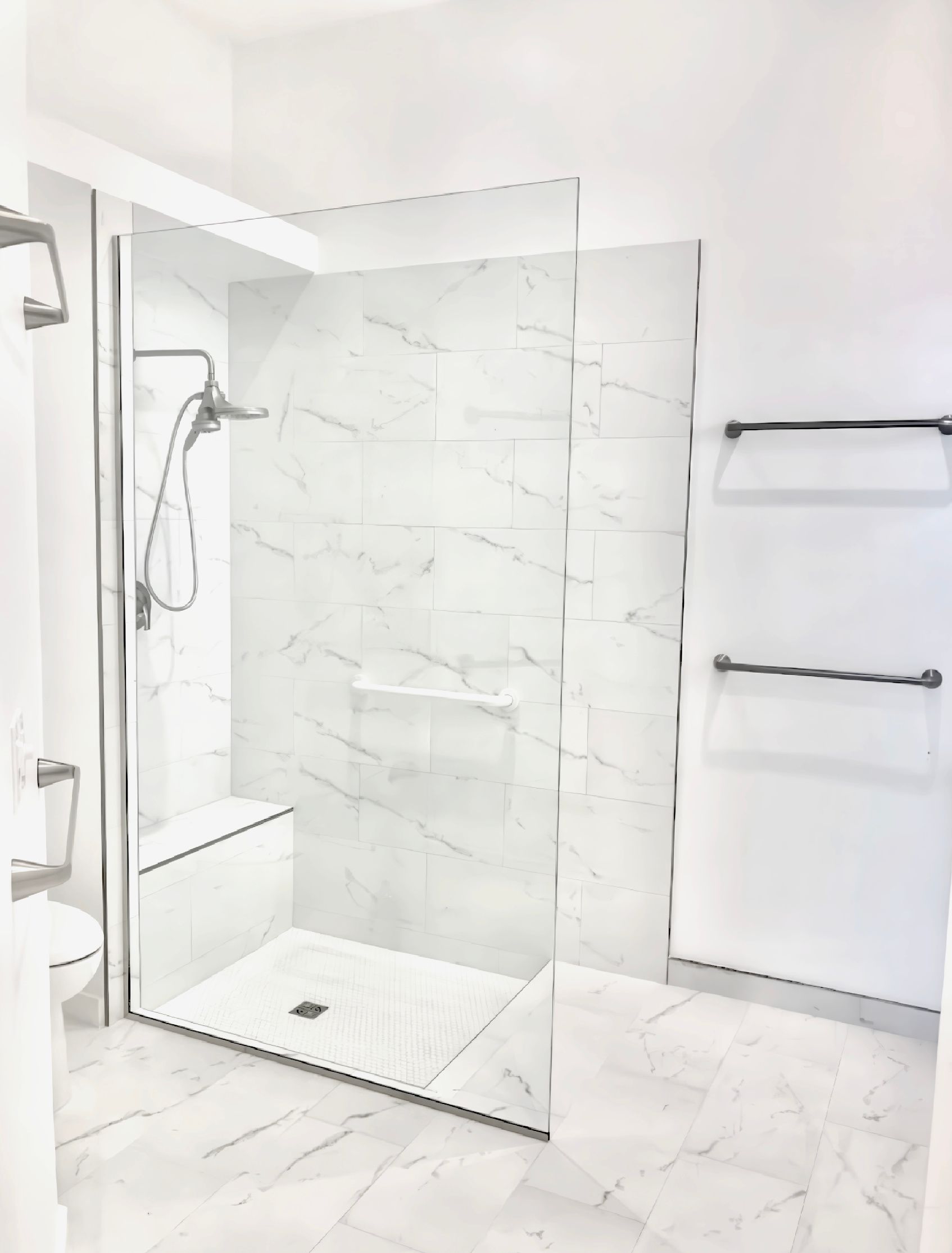 A bathroom with a walk in shower and a toilet.