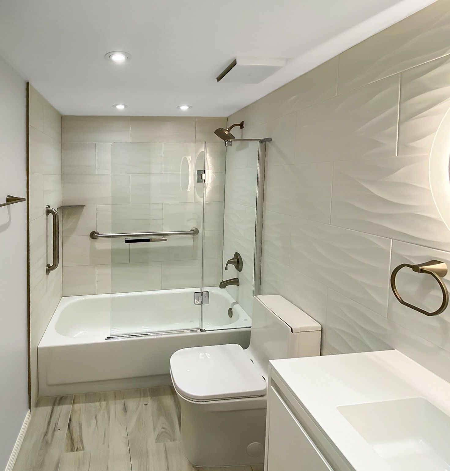 A bathroom with a bathtub toilet and sink