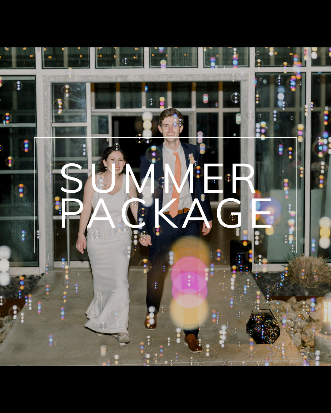 A couple walks outdoors through a bubble-filled entryway towards a glass-paneled building; text reads