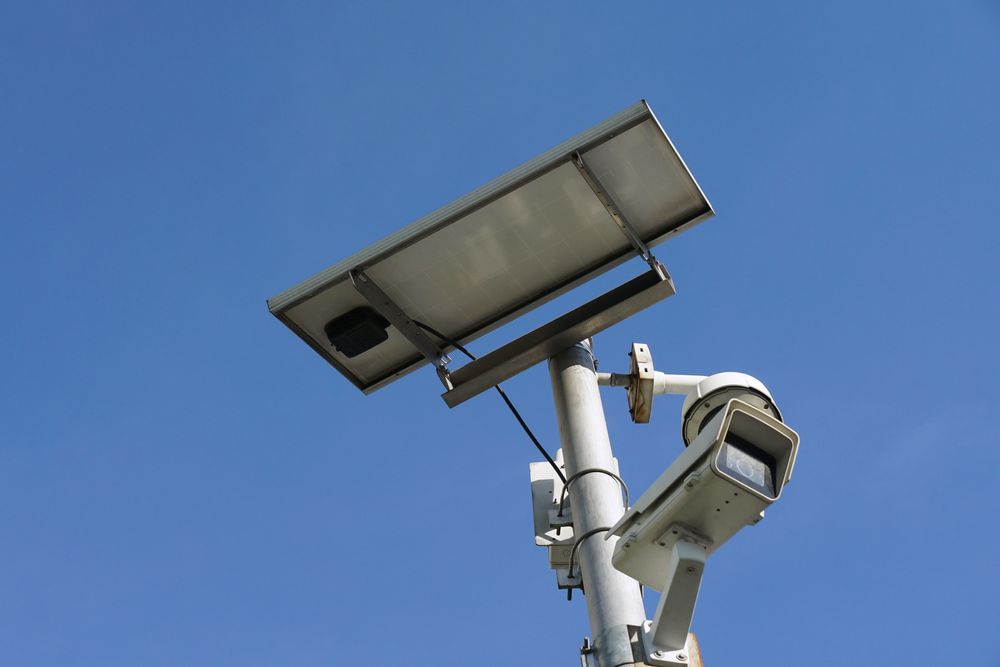 A Security Camera with A Solar Panel on Top of It — Brent Hawe Solar & Electrical in Glenfield Park, NSW