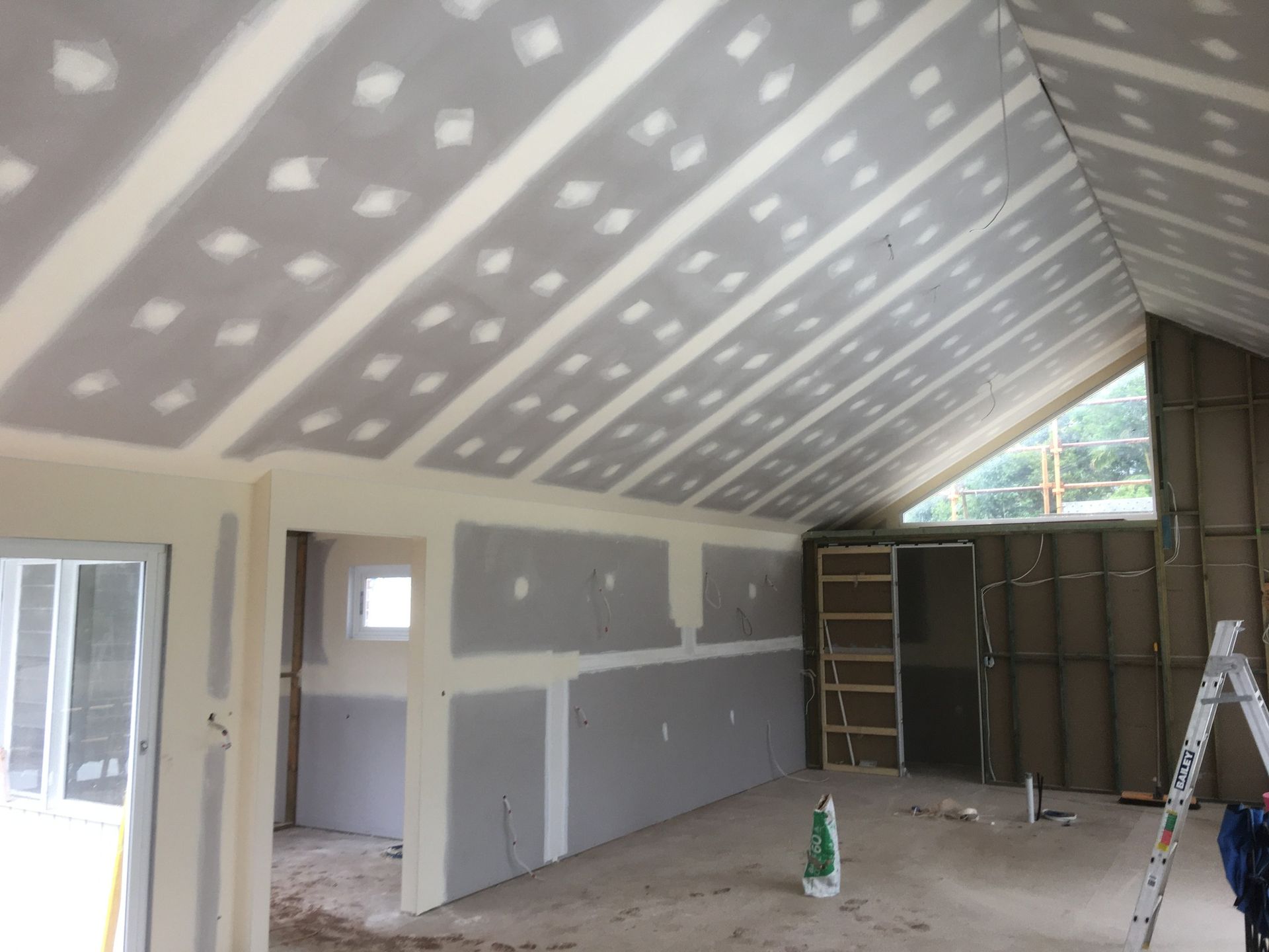 Interior of A Room Under Construction with Drywall Installed on Walls — Completely Plastered North Coast in Byron Bay, NSW