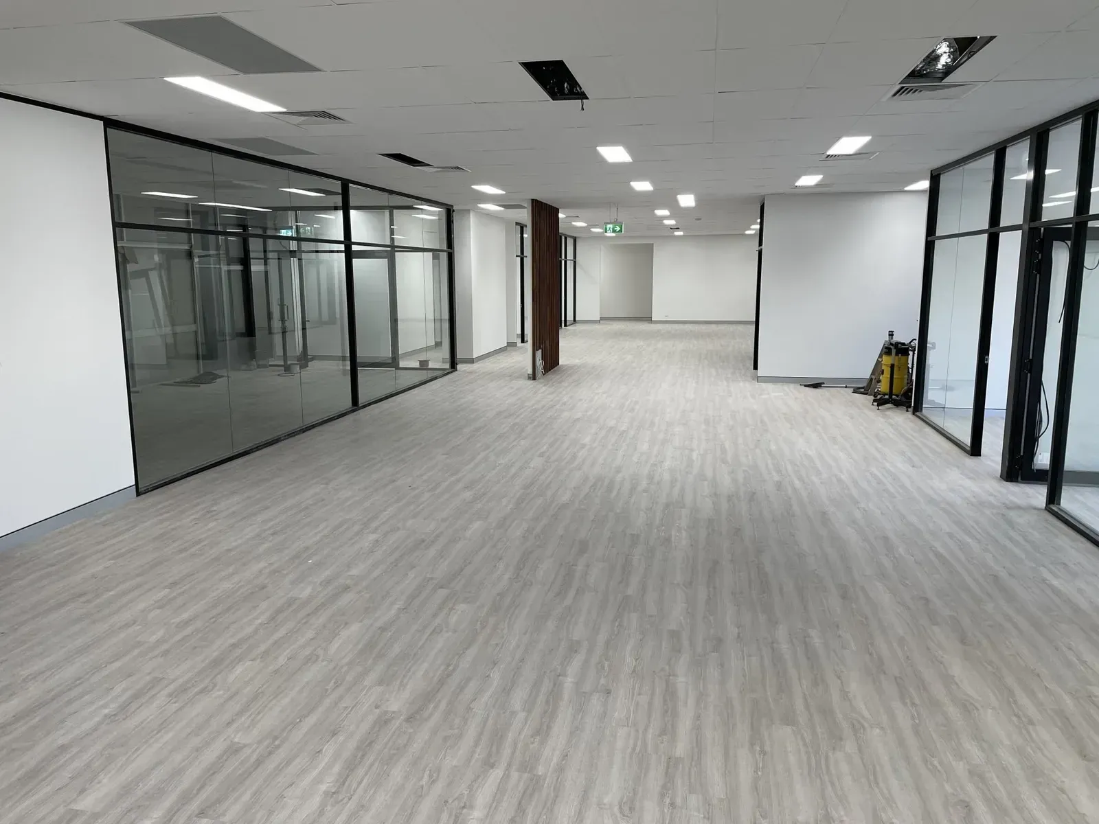 Empty Office Interior with Light Gray Flooring — Completely Plastered North Coast in Goonellabah, NSW