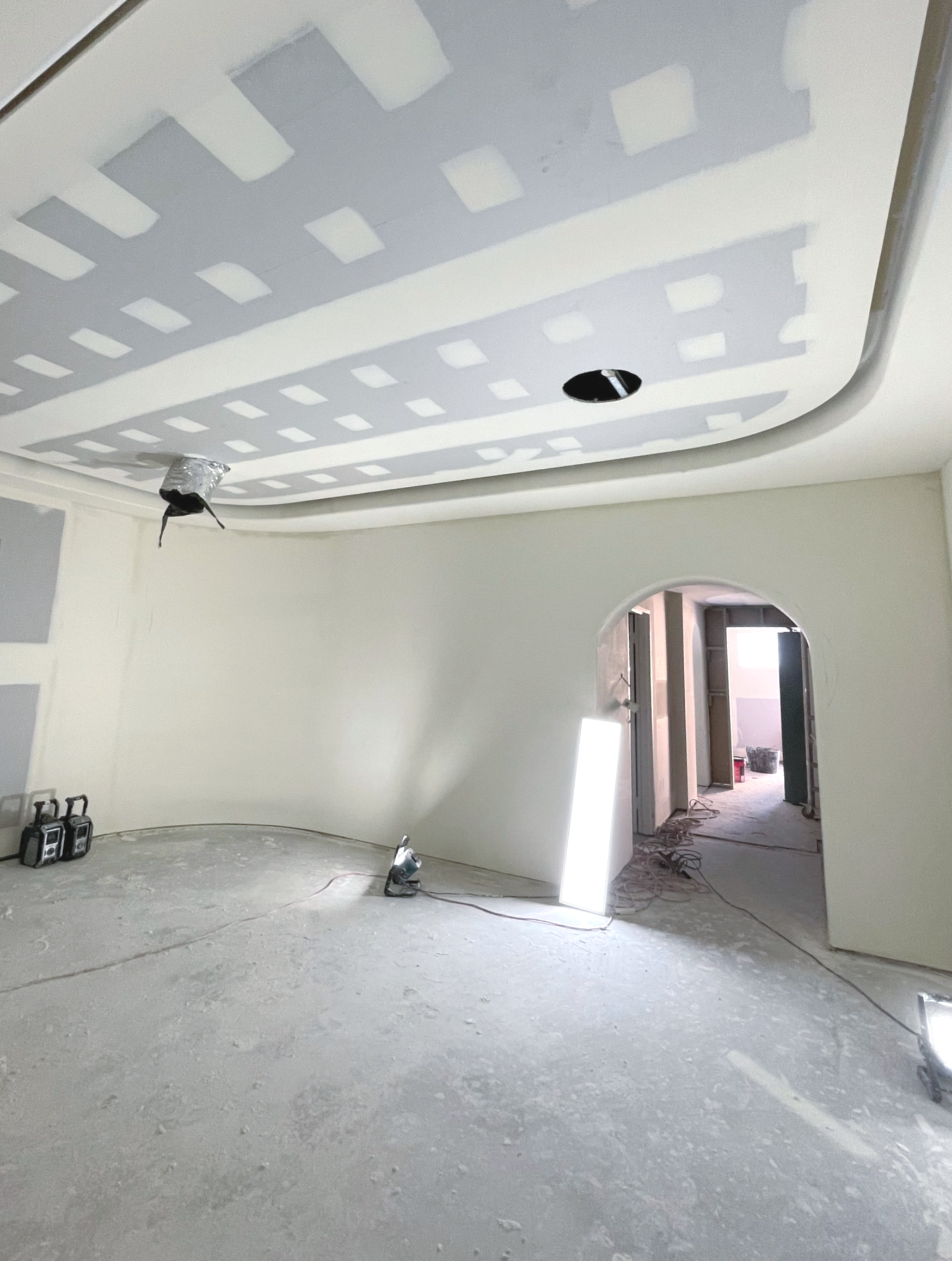 Person Painting a White Wall — Completely Plastered North Coast in Goonellabah, NSW