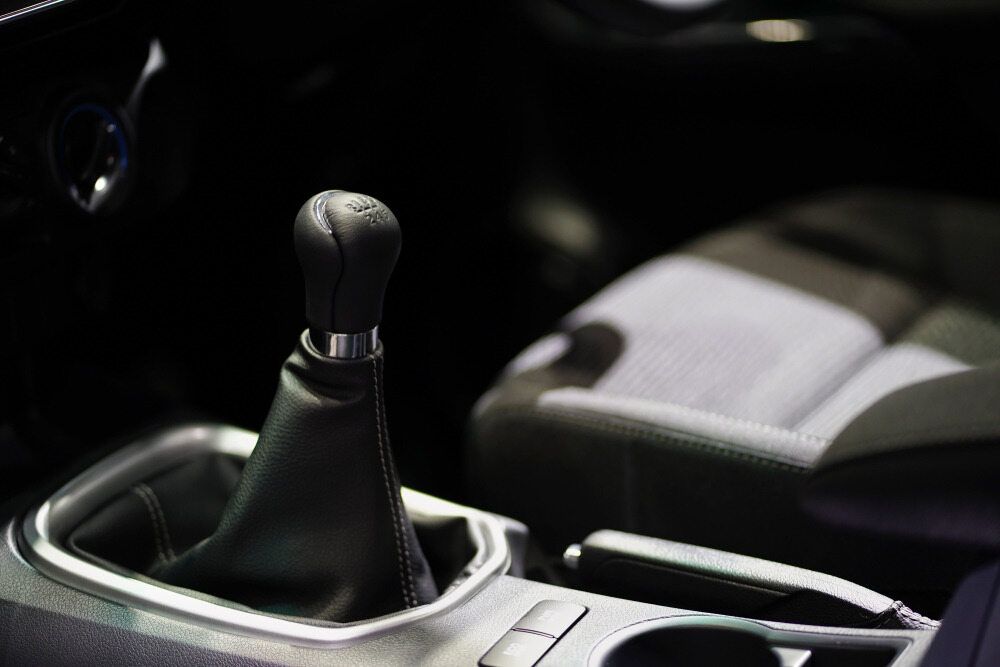 Black Car Gear Shift Knob, Leather Boot, in a Vehicle Interior — The Automotive Den in Ballina, NSW