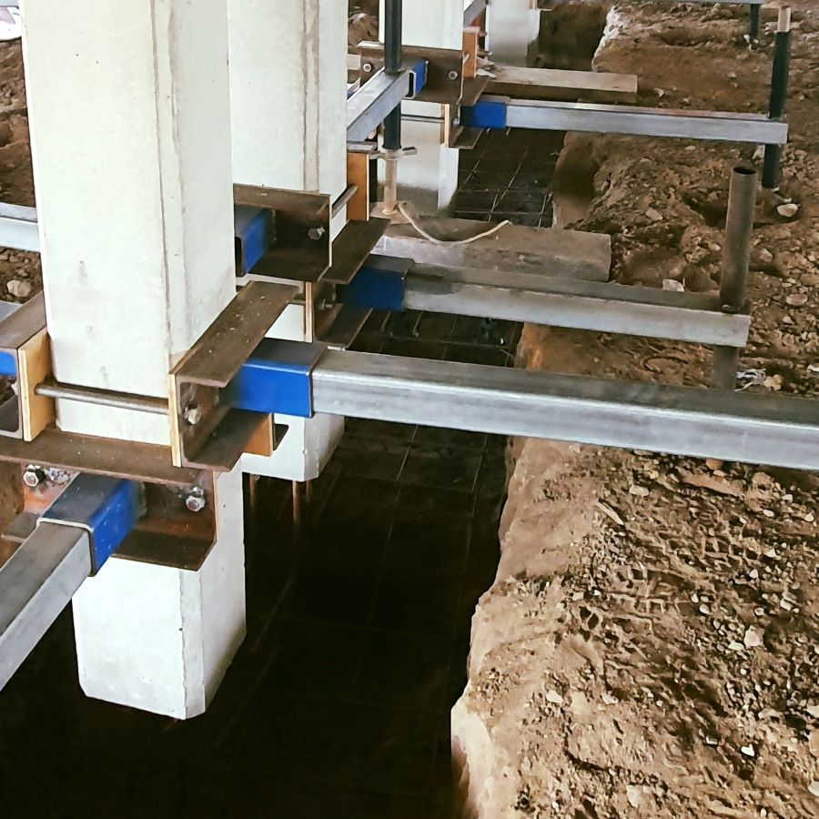 A Row of Concrete Pillars Are Being Supported by Metal Beams  — Pro-Jax Pty Ltd in Julia Creek, QLD