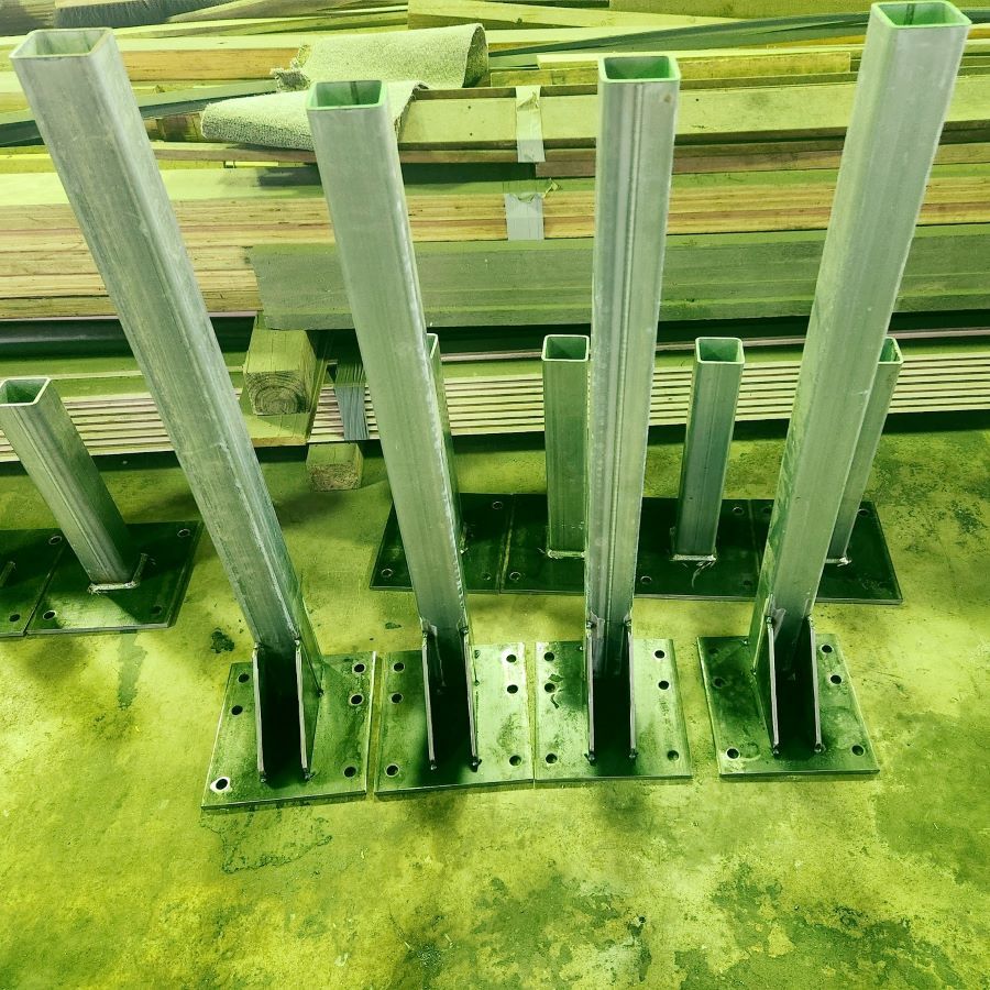 A Bunch of Metal Poles Are Lined Up on a Green Surface  — Pro-Jax Pty Ltd in Hughenden, QLD