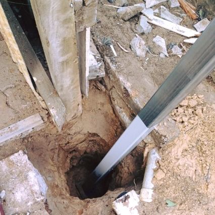 A Metal Pole is Sticking Out of a Hole in the Ground  — Pro-Jax Pty Ltd in Julia Creek, QLD