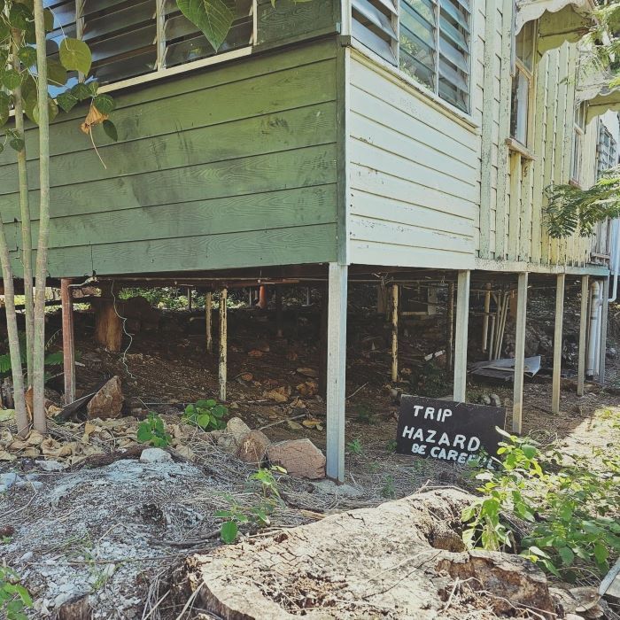 A House With a Sign That Says Trip Hazard Be Careful — Pro-Jax Pty Ltd in Bohle, QLD