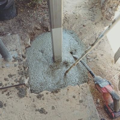 A Person is Pouring Concrete Into a Hole in the Ground  —— Pro-Jax Pty Ltd in Julia Creek, QLD
