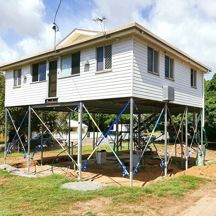 A White House on Stilts in a Grassy Area  — Pro-Jax Pty Ltd in Bohle, QLD