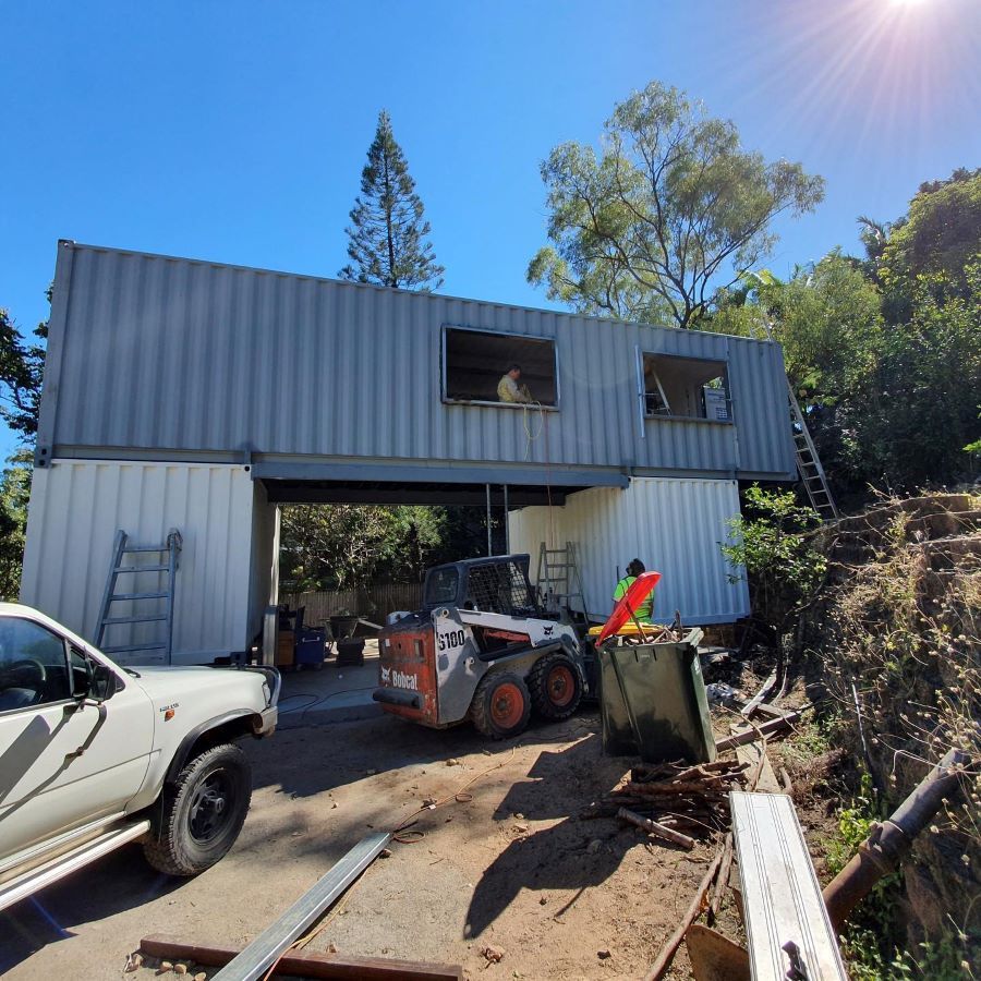 A Bobcat is Parked in Front of a Building Under Construction  — Pro-Jax Pty Ltd in Emerald, QLD