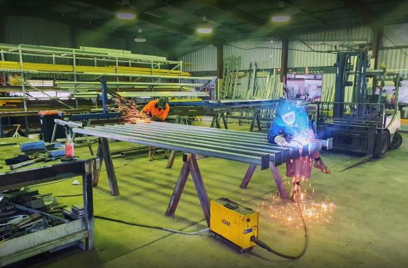 Two Welders Working in a Metal Fabrication Shop — Pro-Jax Pty Ltd in Ingham, QLD