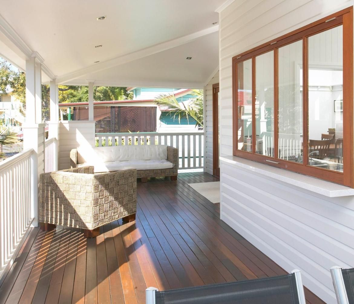 A Porch With a Couch and Chairs on It — Pro-Jax Pty Ltd in Bohle, QLD