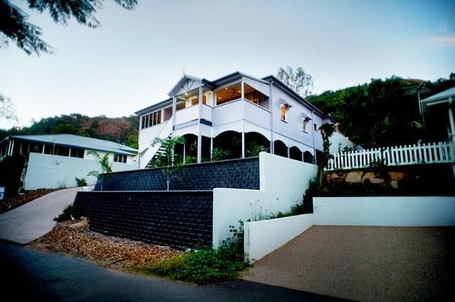A Large White House Sits on Top of a Hill — Pro-Jax Pty Ltd in Bohle, QLD
