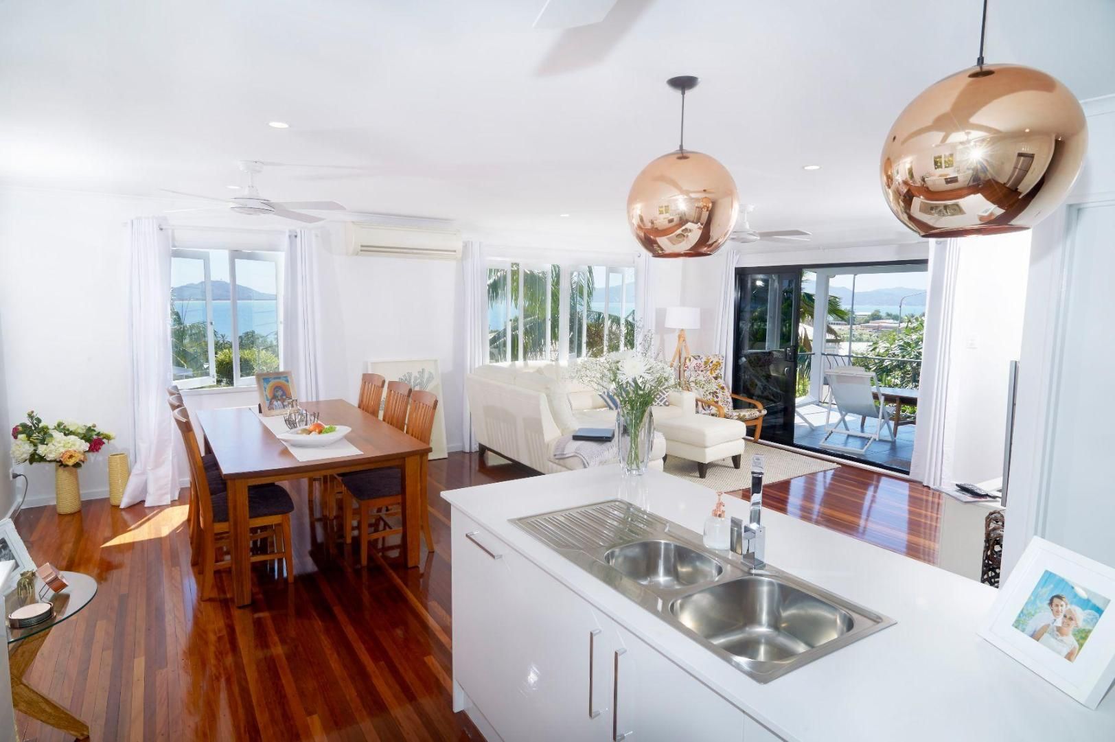 A Kitchen With a Sink, Dining Table and Chairs — Pro-Jax Pty Ltd in Bohle, QLD