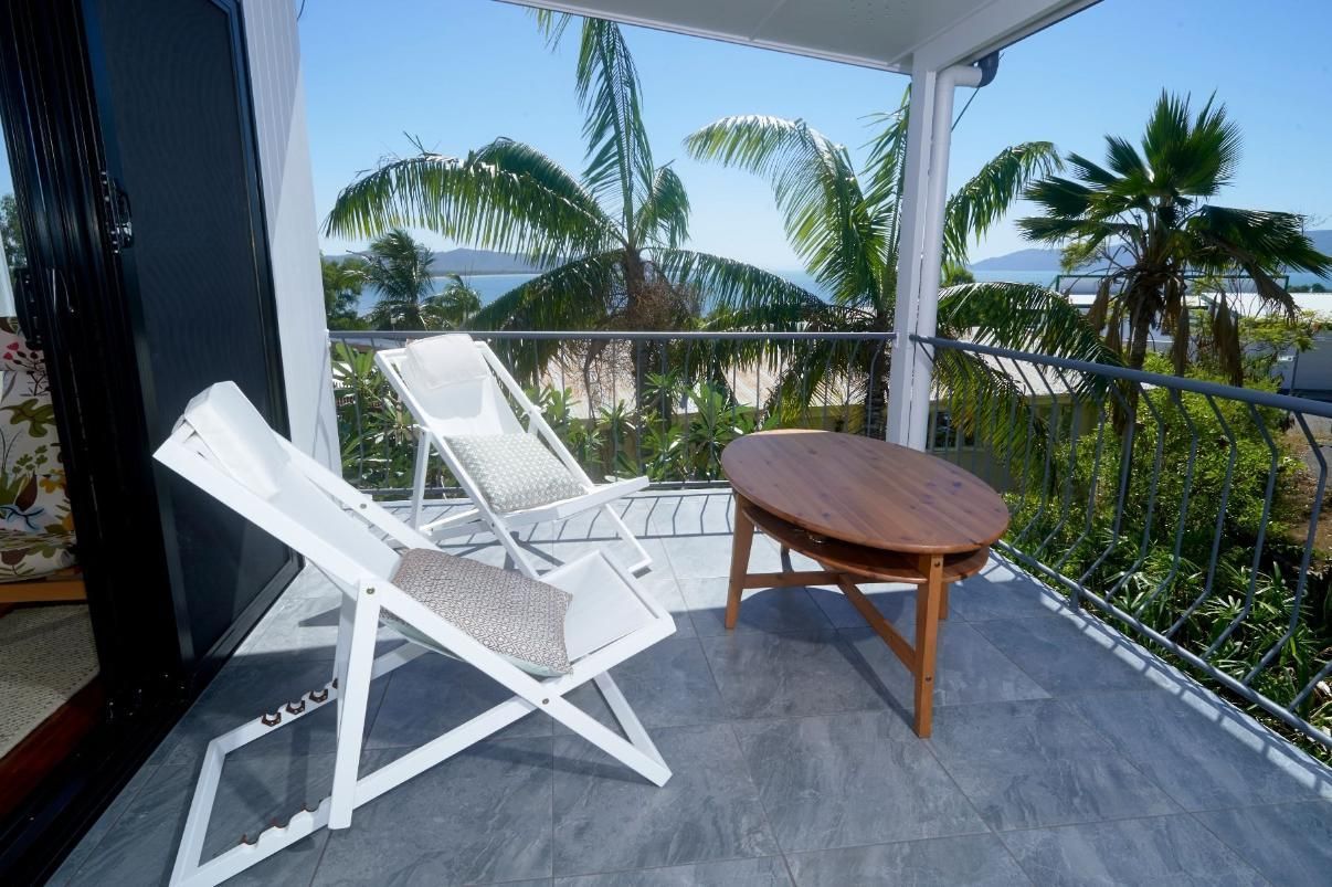 There Are Two Chairs and a Table on the Balcony — Pro-Jax Pty Ltd in Bohle, QLD