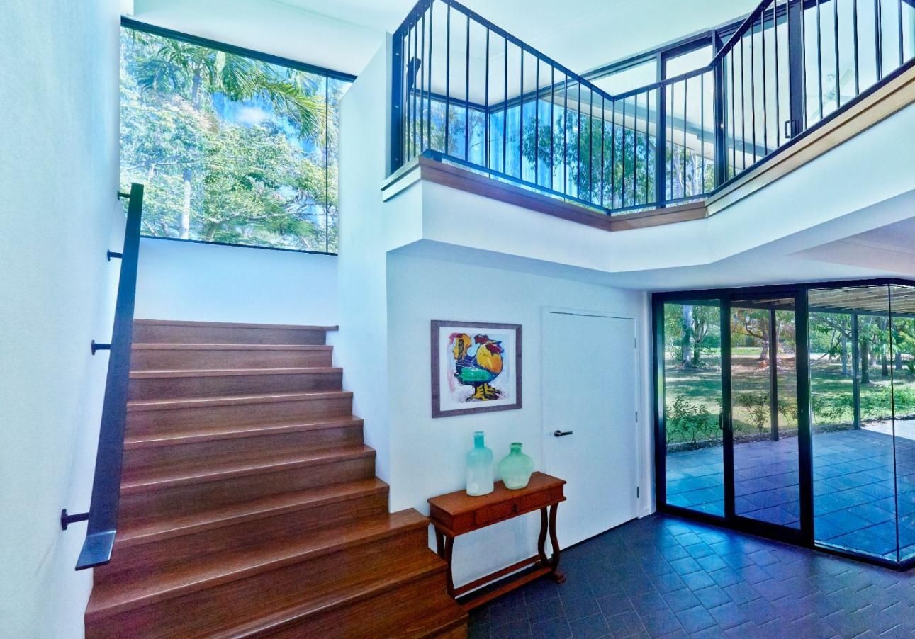 A Hallway With Stairs Leading Up to the Second Floor of a House — Pro-Jax Pty Ltd in Bohle, QLD