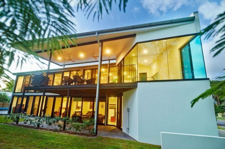 A white house with a lot of windows and a balcony — Pro-Jax Pty Ltd in Bohle, QLD