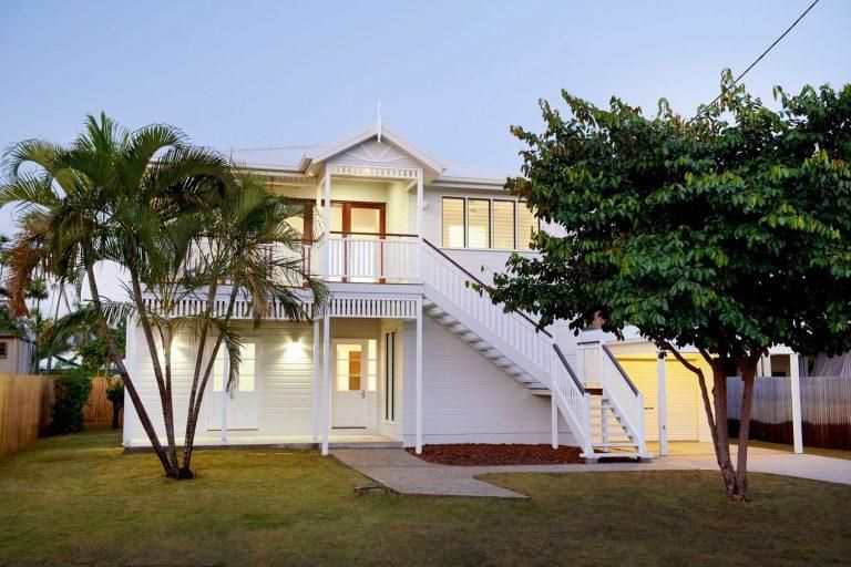 A White House With Stairs and Palm Trees in Front of It — Pro-Jax Pty Ltd in Bohle, QLD
