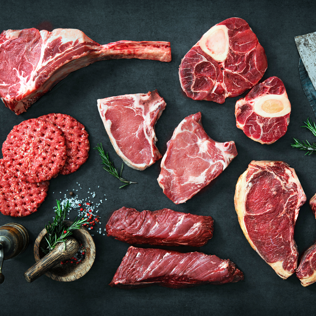 There are many different types of meat on the table.