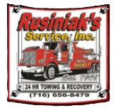 Rusniak's Service, Inc. towing and recovery sign with truck and phone number 716-656-8479