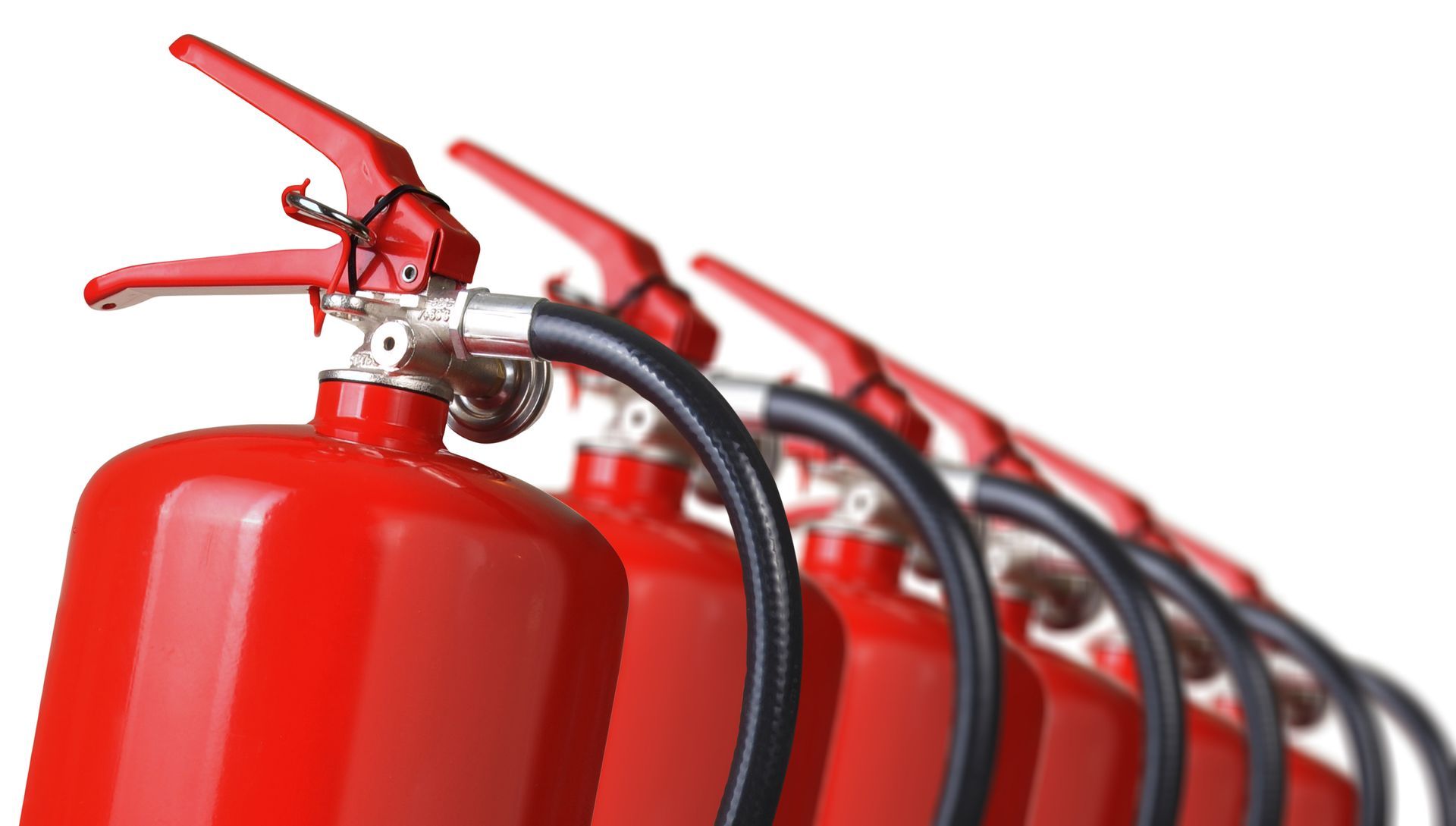 Wall-mounted red cabinet with fire extinguishers and hose reel for emergency fire protection. Fire extinguishers close up isolated on white background.