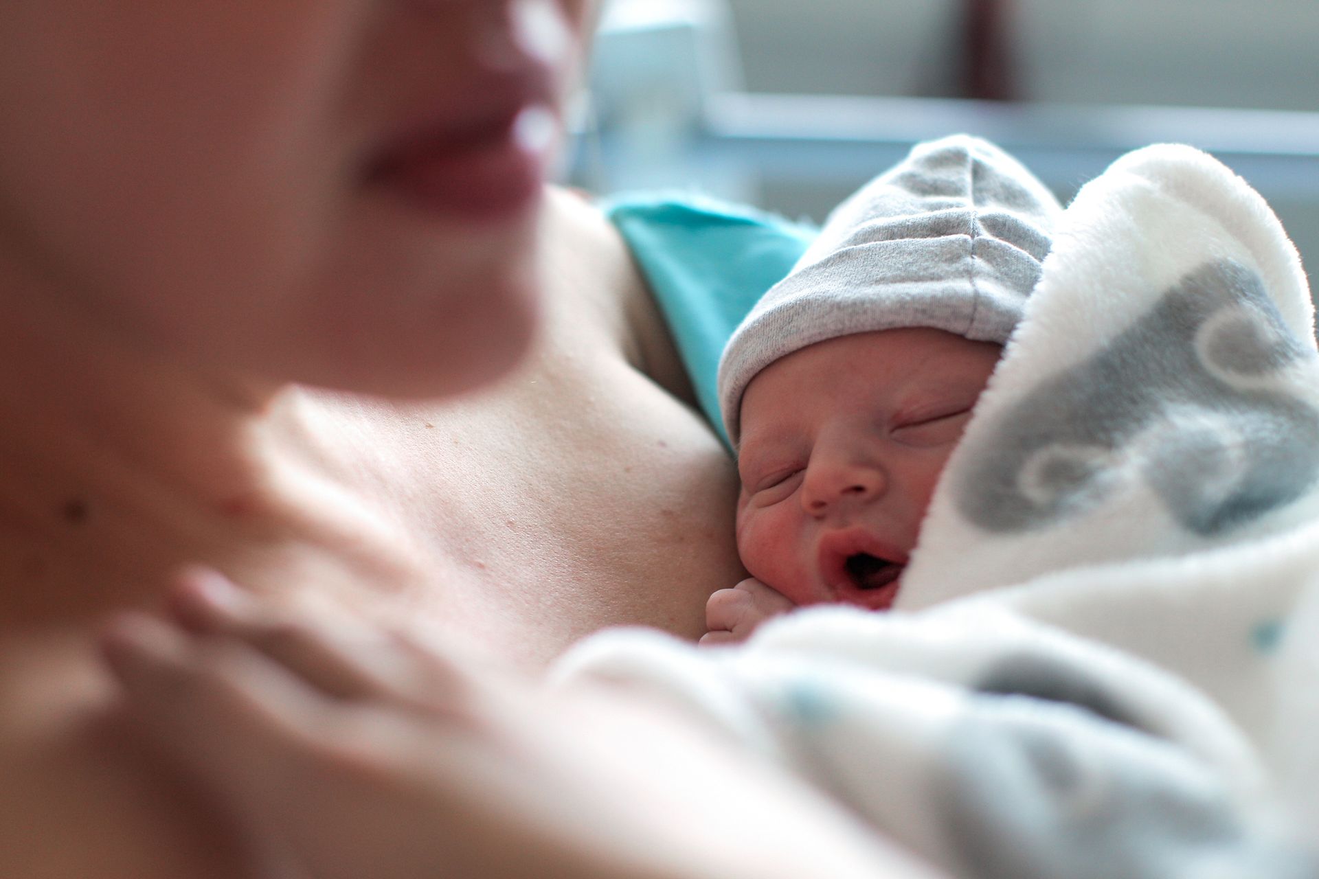 Newborn Baby Wrapped in Blanket — Gowen, MI — RiverSong Midwifery
