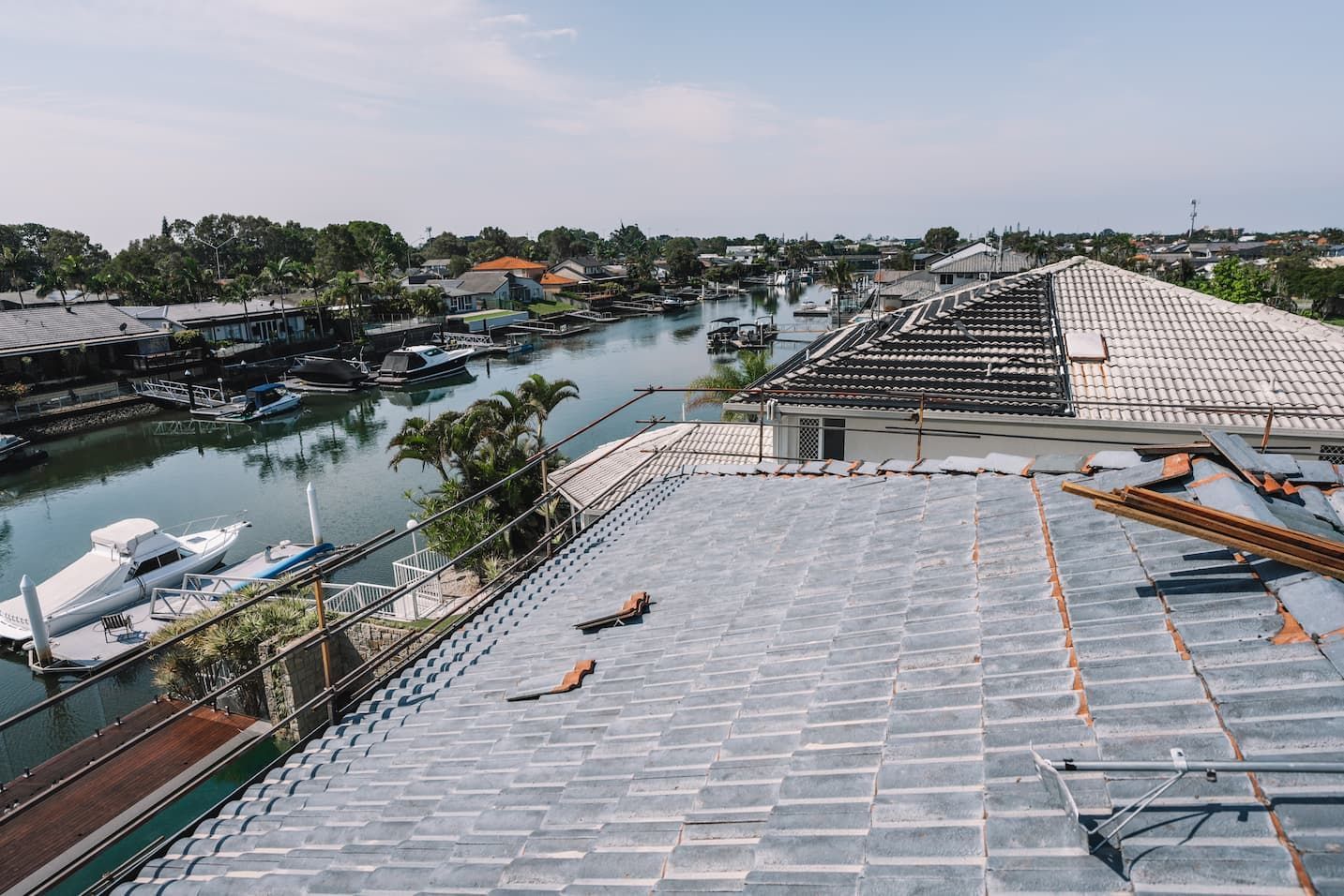 An aerial view of a roof with a river in the background.